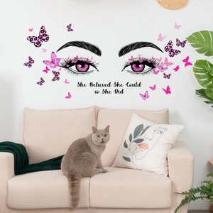Minimalist wall sticker with eyes, pink butterflies and 'She Believed She Could' quote