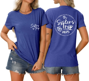 Detail of Sisters Trip 2025 print on blue cotton T-shirt showing front and back design