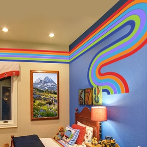 Vibrant rainbow wall sticker detail in a cozy children's room with colorful stripes