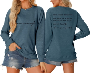 Detailed back view of a blue crewneck sweatshirt with 'Dear person behind me' quote