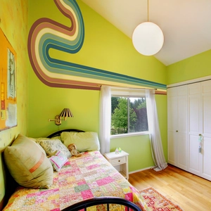 Detail of bohemian rainbow wall stickers with retro wave patterns in a kids bedroom