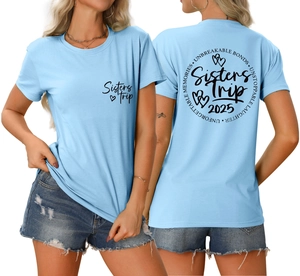 Detail of Sisters Trip 2025 light blue cotton t-shirt with heart graphics and back print