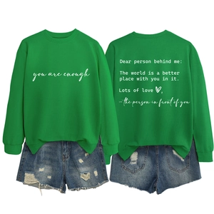Front and back view of green crewneck sweatshirt with you are enough print and denim shorts