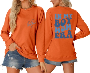 Detailed front and back view of a bright orange Boy Mom Era sweatshirt with blue lettering