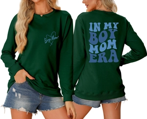 Detailed front and back views of dark green Boy Mom Era sweatshirt with blue graphics