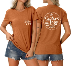 Detail of sisters trip 2025 print on rust-red crewneck T-shirt showing front and back views
