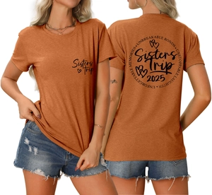 Front and back detail of caramel t-shirt featuring Sisters Trip 2025 graphic prints