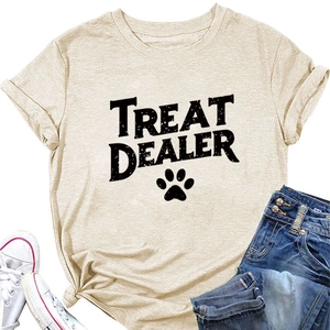 Flat lay of beige cotton T-shirt featuring Treat Dealer text and paw print design