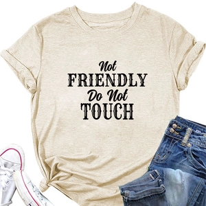 Detail of loose beige T-shirt featuring bold Not Friendly Do Not Touch slogan print