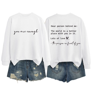 Front and back view of white crewneck sweatshirt with inspiring quote and denim shorts