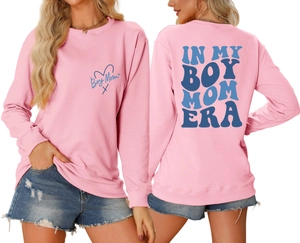Detail of pink Boy Mom Era sweatshirt showing front logo and back vintage lettering
