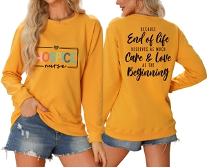 Detail view of yellow long-sleeve sweatshirt with ribbed cuffs and double-sided print