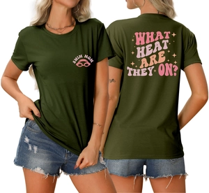 Detail of Swim Mom text and What Heat Are They On retro pink print on olive green t-shirt