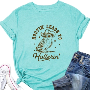 Close-up of turquoise cotton T-shirt featuring owl with cowboy hat and text design