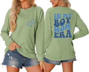 Front and back detail of sage green Boy Mom Era sweatshirt with blue chest logo and back print
