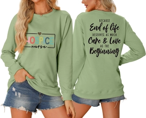 Detailed front and back view of light green crewneck sweatshirt with hospice nurse prints
