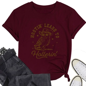 Close-up of burgundy T-shirt with owl graphic flat lay with jeans and sneakers