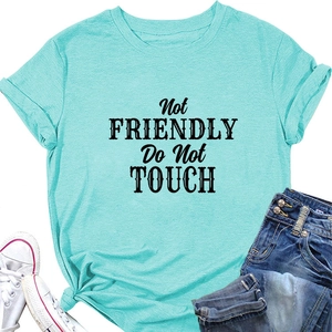 Detail of mint green t-shirt with black Not Friendly Do Not Touch slogan print