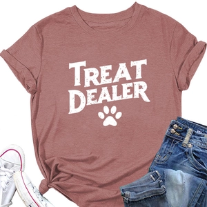 Flat lay of pink casual t-shirt with Treat Dealer print and paw motif with jeans