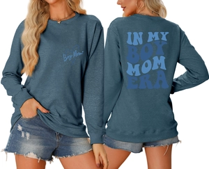 Detail of In My Boy Mom Era blue sweatshirt showing front and back graphic prints