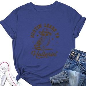 Flat lay of navy short sleeve T-shirt with owl graphic paired with jeans and shoes