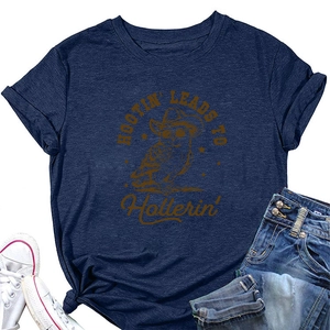 Close-up of navy owl graphic t-shirt styled with blue jeans and white sneakers