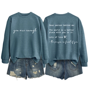 Front and back view of crewneck sweatshirt with 'you are enough' text and denim shorts