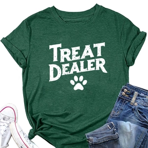 Macro view of dark green t-shirt fabric texture and white paw print graphic detail