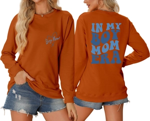 Detailed front and back view of caramel orange boy mom era sweatshirt with blue print
