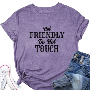 Flat lay of purple cotton T-shirt with black Not Friendly Do Not Touch slogan and jeans