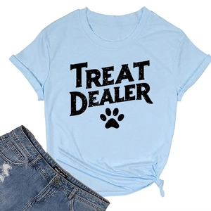 Flat lay of light blue crew neck t-shirt with black TREAT DEALER text and paw print