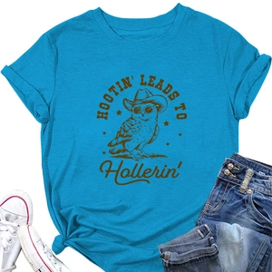 Close-up of blue cotton T-shirt featuring an owl print with cowboy hat and sunglasses