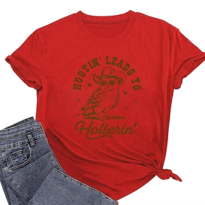 Detail of red crew neck T-shirt featuring hootin' owl print and denim jeans display