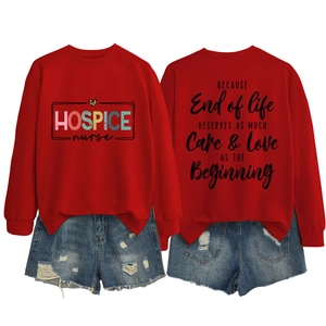Detail view of the quote on the back of this red long-sleeved nurse crewneck sweatshirt