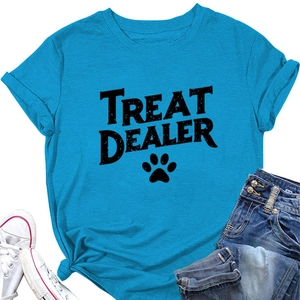 Flat lay of teal cotton T-shirt featuring Treat Dealer letter print and paw motif