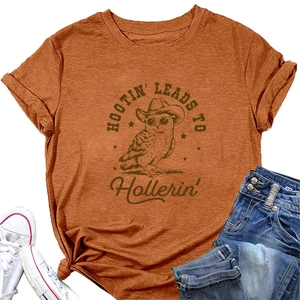 Detail of orange t-shirt featuring vintage owl graphic print and front knot tie detail