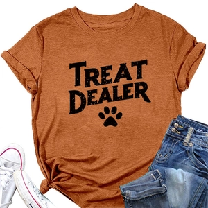 Detail of orange crew neck T-shirt with black Treat Dealer print and paw motif