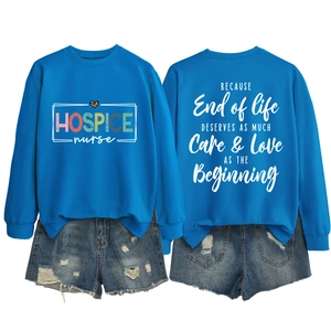 Detail of royal blue sweatshirt showing ribbed neckline and Hospice Nurse graphic print