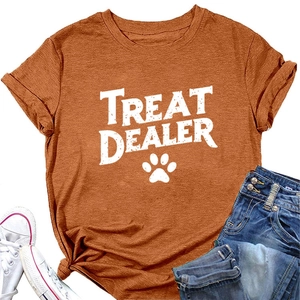 Flat lay of casual orange-brown crewneck T-shirt with Treat Dealer pet paw print design