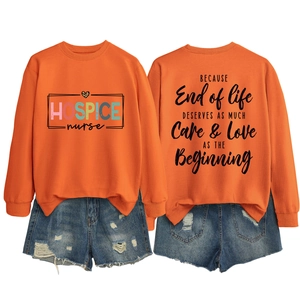 Detailed back view of orange sweatshirt featuring a black serif inspirational quote print