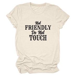 Detail of cream t-shirt showing Not Friendly Do Not TOUCH text and rolled cuff sleeves