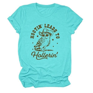 Detail of turquoise t-shirt featuring a retro cowboy owl print and HOOTIN LEADS TO text