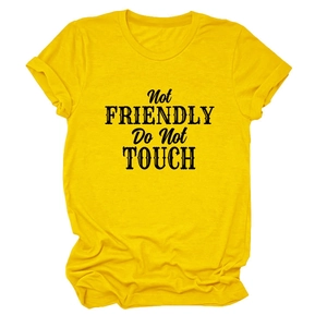 Detail of loose yellow cotton T-shirt featuring Not Friendly Do Not Touch slogan print