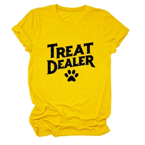 Detail of a bright yellow cotton T-shirt featuring bold TREAT DEALER print and paw icon