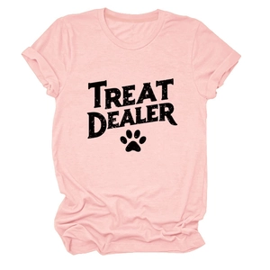 Close-up of pink crew neck T-shirt featuring Treat Dealer text and paw print design