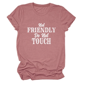Detail of Not Friendly text print on pink short sleeve t-shirt with rolled cuffs