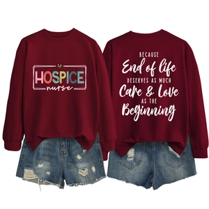 Front and back view of a burgundy long-sleeve sweatshirt with Hospice Nurse print and denim shorts