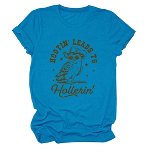Detail of bright blue cotton T-shirt featuring a cowboy owl print and folded sleeve cuffs