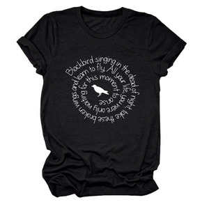 Flat lay of a black cotton crew neck t-shirt with white circular bird and lyric graphic