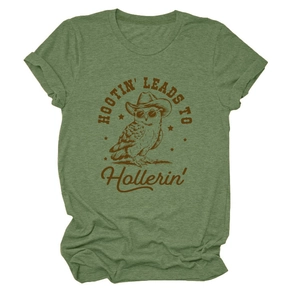 Flat lay of green t-shirt featuring a retro owl wearing a cowboy hat with hootin text